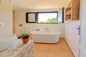 Bathtub, hair dryer, towels, soap