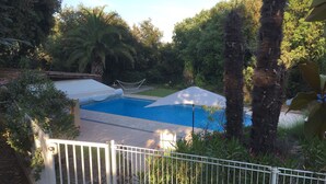A swimming pool surrounded by lush greenery and a white fence. - Villa With Pool In St Paul En Foret, Nr Fayence, Cote D'azur-Provence, France (Saint-Paul-En-Forêt)
