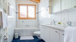 Bathtub, hair dryer, towels