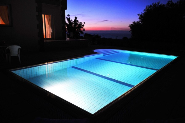 Stunning view of swimming pool at sun set