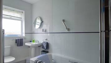 Combined shower/bathtub, hair dryer, towels, soap