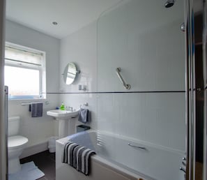 Combined shower/tub, hair dryer, towels, soap