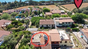 An aerial view of a coastal residential area with houses, trees, and a clear view of the sea. - Sa Domu De Sa Murta 1B: 200 mtr to Baia Marina!!! Free Bikes & Kayaks. IUN P2964 (Torre di Bari)