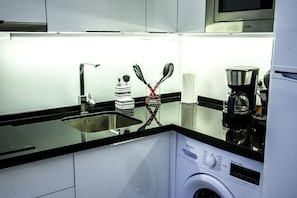 Fridge, microwave, stovetop, coffee/tea maker
