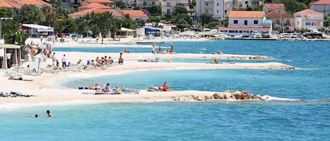 On the beach, sun-loungers, beach towels