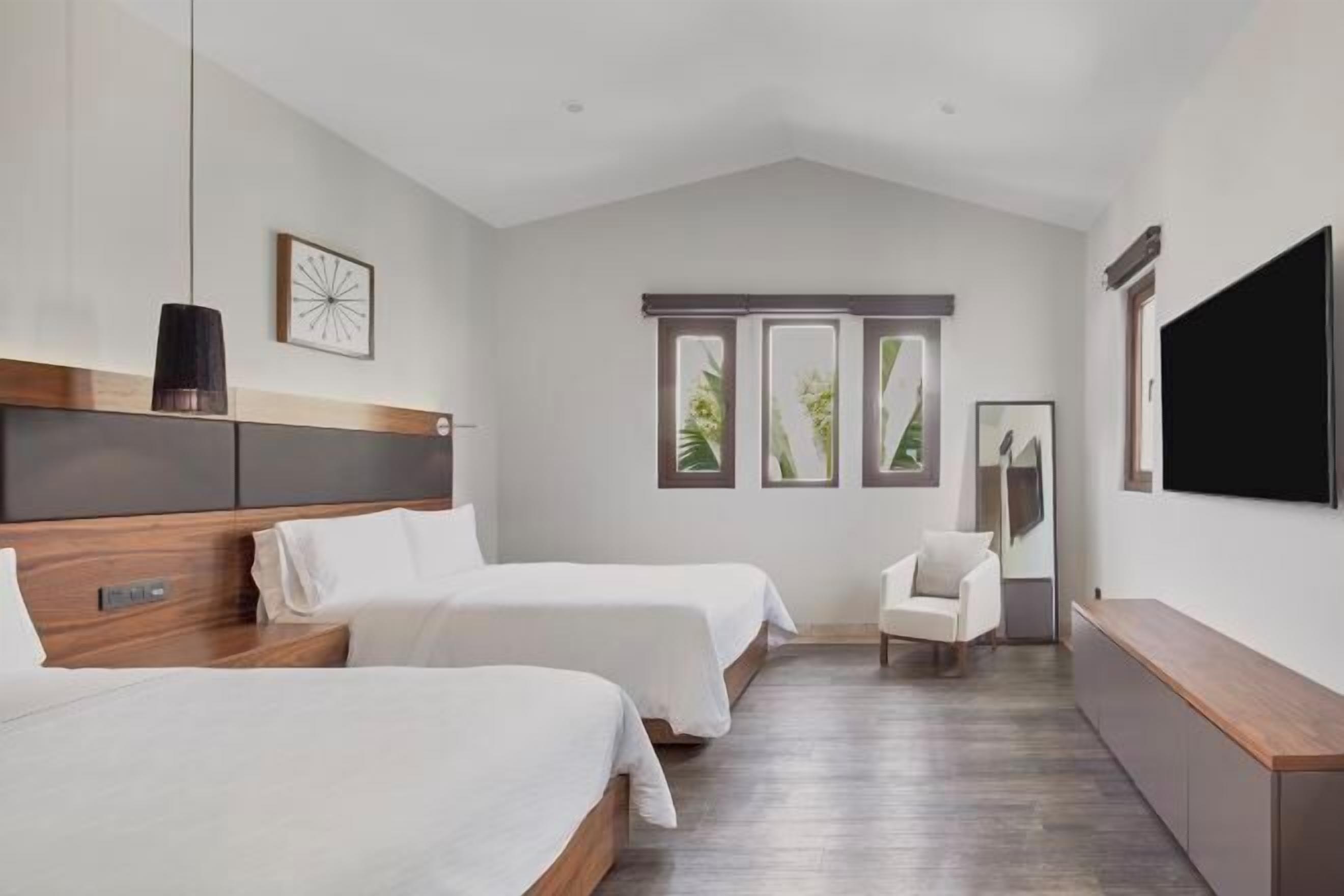 Premium bedding, down comforters, pillowtop beds, in-room safe