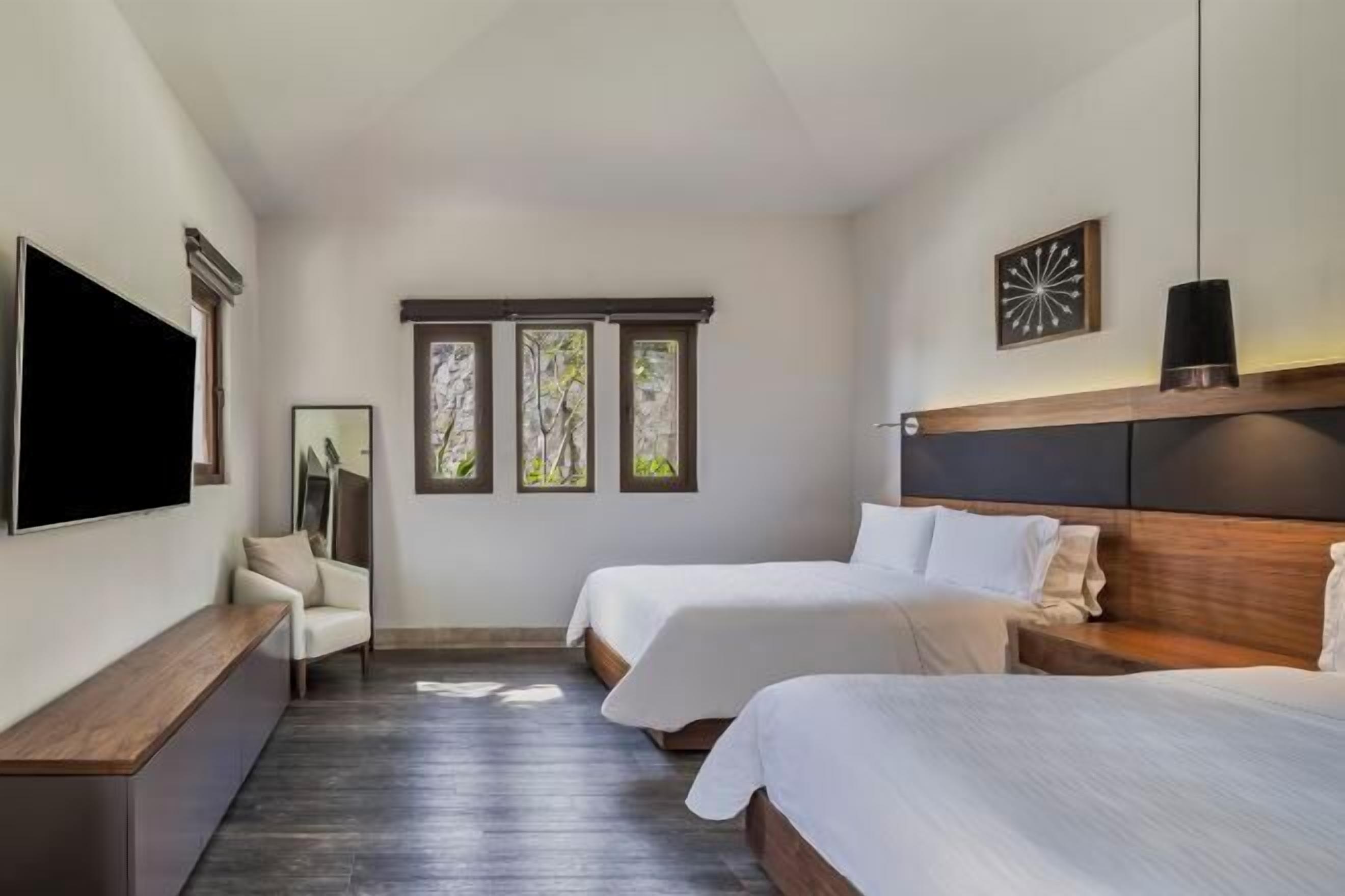 Premium bedding, down comforters, pillowtop beds, in-room safe