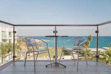 Relax on the private apartment balcony overlooking the sea