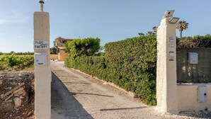 A paved road leading to a property with a sign indicating '348/ATRI/TERINTZ'. - House / Villa - MarsalaHouse with garden (Marsala)