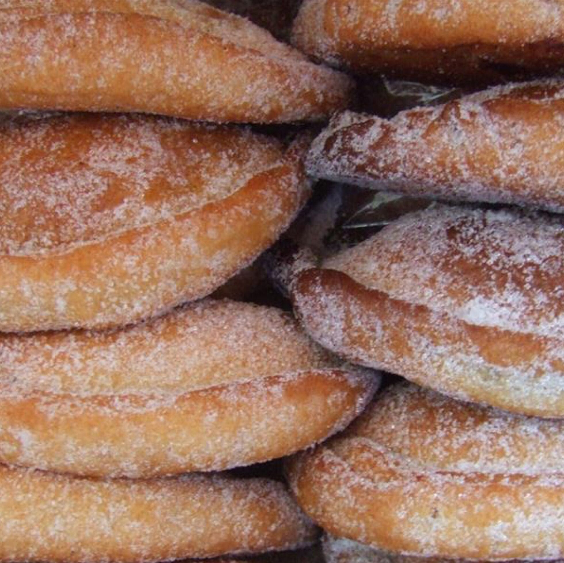 A close-up of a stack of sugar-coated pastries.