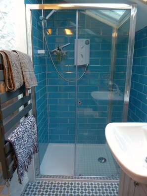 Shower, hair dryer, towels, soap