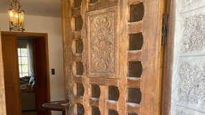 A wooden door with intricate carvings and a grid pattern. - Mansion - SORBOLLANO (Sorbollano)