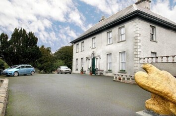 View of house as approached from elegant driveway
