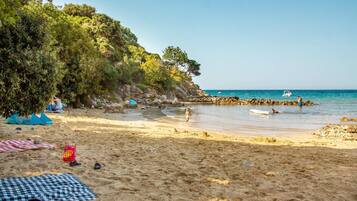 On the beach, sun loungers
