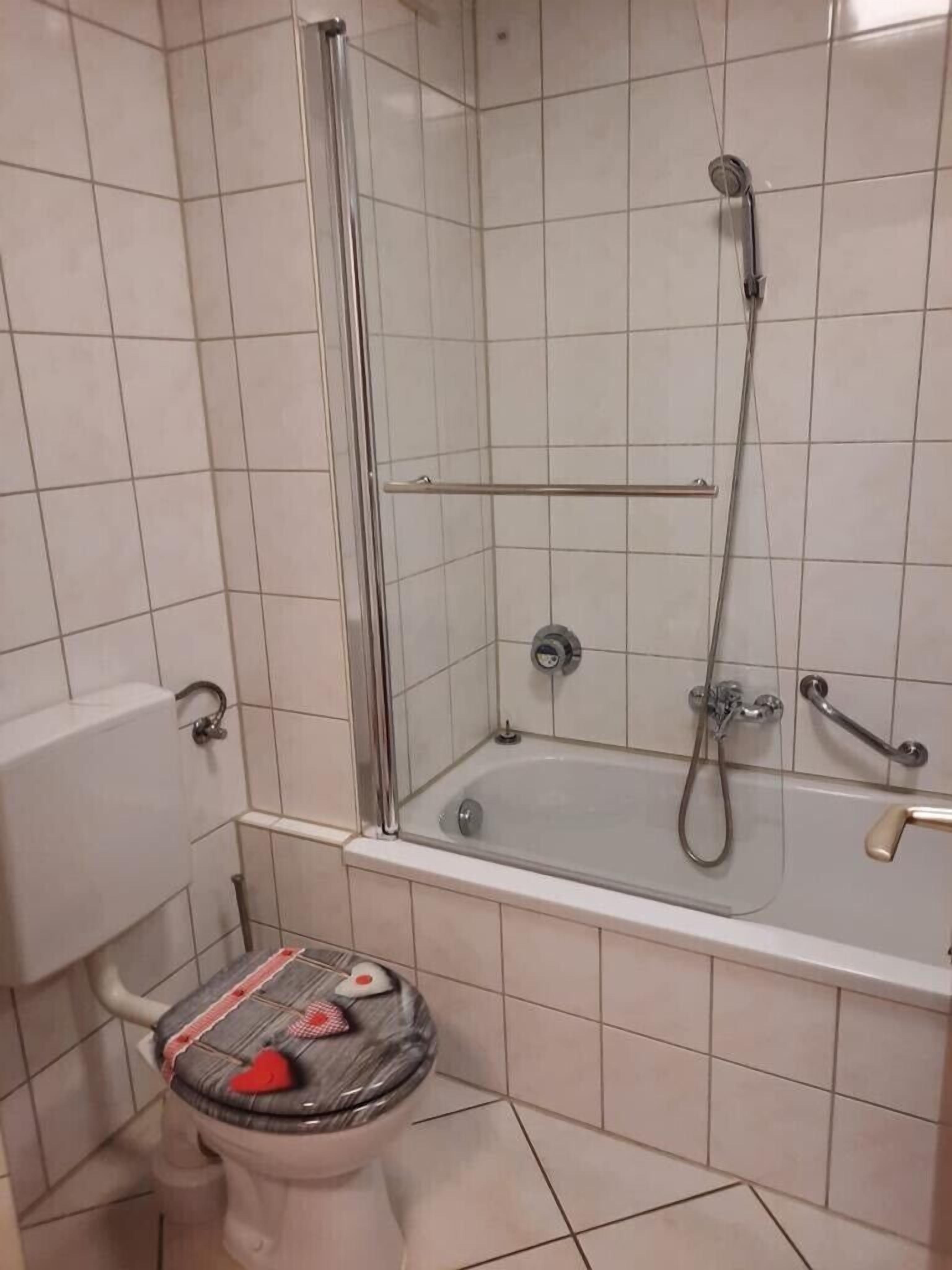 Bathtub, hair dryer, towels, soap