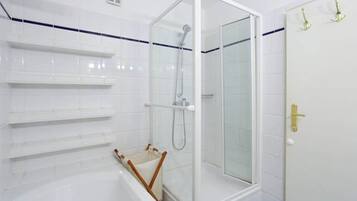 Combined shower/tub, hair dryer, towels, toilet paper