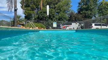 Seasonal outdoor pool, open noon to 8:00 PM, pool umbrellas