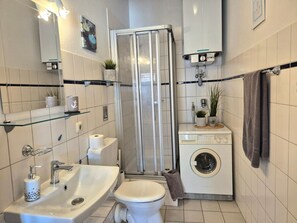 Shower, hair dryer, towels, soap