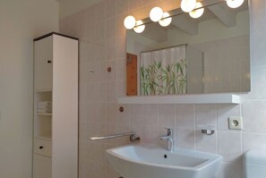 Bathtub, hair dryer, towels, soap