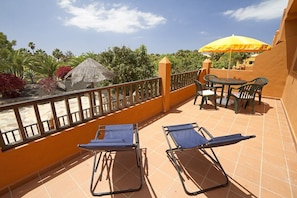 Sun deck facing the palm trees