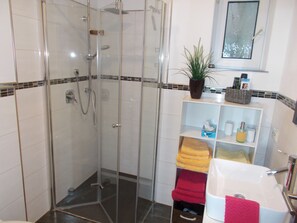 Shower, hair dryer, towels, soap
