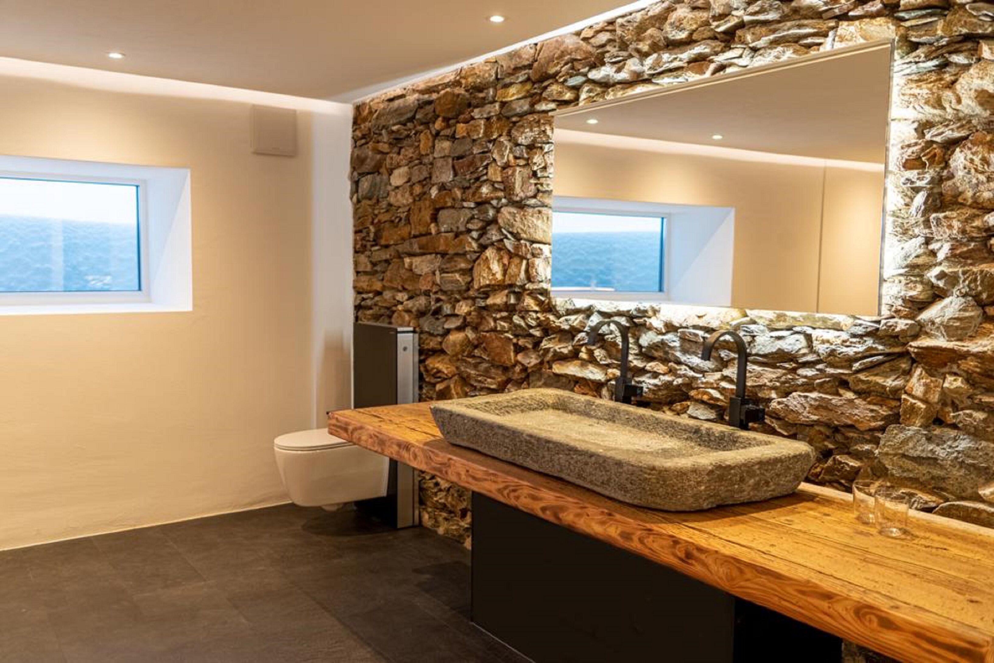 Bathtub, hair dryer, towels, toilet paper