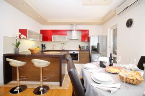 fully equipped kitchen with living room - air conditioned
