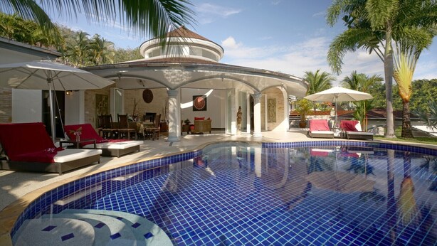 A pool area with lounge chairs, a covered seating area, and palm trees. - Luxurious, quiet, private Pool-Villa Lotus, 7/7 housekeeper/butler (Phuket)