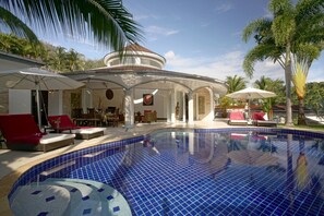 A pool area with lounge chairs, a covered seating area, and palm trees. - Luxurious, quiet, private Pool-Villa Lotus, 7/7 housekeeper/butler (Phuket)