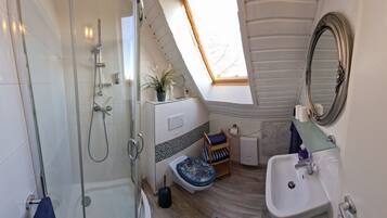 Shower, hair dryer, towels, soap