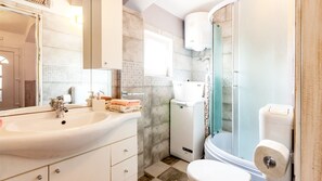 Bathtub, hair dryer, towels, soap