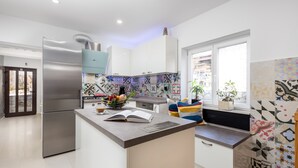 A modern kitchen with a central island, stainless steel appliances, and colorful backsplash tiles. - New villa for 6 persons with private pool and sea view (Smokvica Krmpotska/Klenovica)
