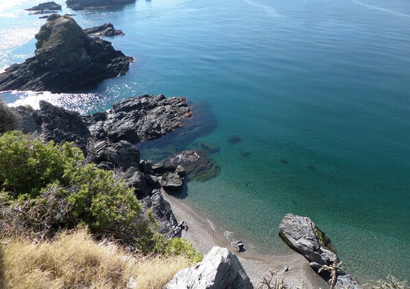 Experience the rugged coastline with rocky outcrops and serene waters.