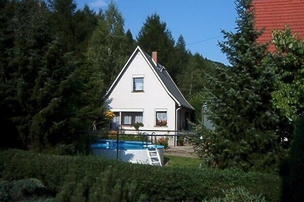 Cozy vacation home with an outdoor pool in a peaceful location by the forest
