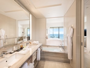 Separate tub and shower, rainfall showerhead, free toiletries