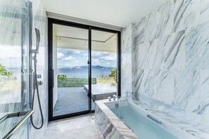 Cliff Villa with Private Pool, Natural Hot spring and Lounge access Included | Bathroom | Separate tub and shower, rainfall showerhead, free toiletries - Halekulani Okinawa (Onna)