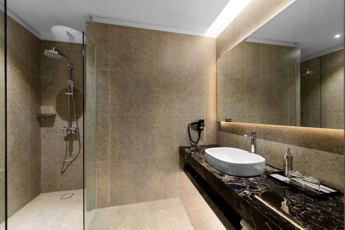 studio, 1 king bed | bathroom | shower, rainfall showerhead, free toiletries, hair dryer