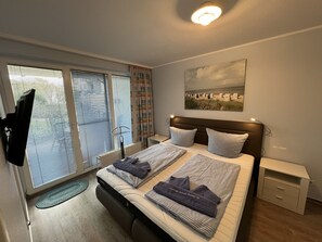 2 habitaciones, tabla de planchar con plancha, cuna de viaje y wifi 
