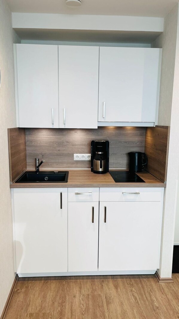 Fridge, microwave, stovetop, coffee/tea maker
