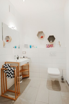 Shower, hair dryer, towels, soap