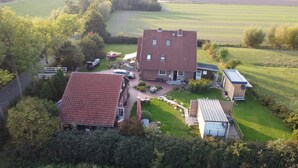 An aerial view of a residential property with two main buildings, a driveway, and surrounding greenery. - Best of Kollmar, app. with terrace for 2 pers. absolutely quiet - Best of Kollmar, (Kollmar)