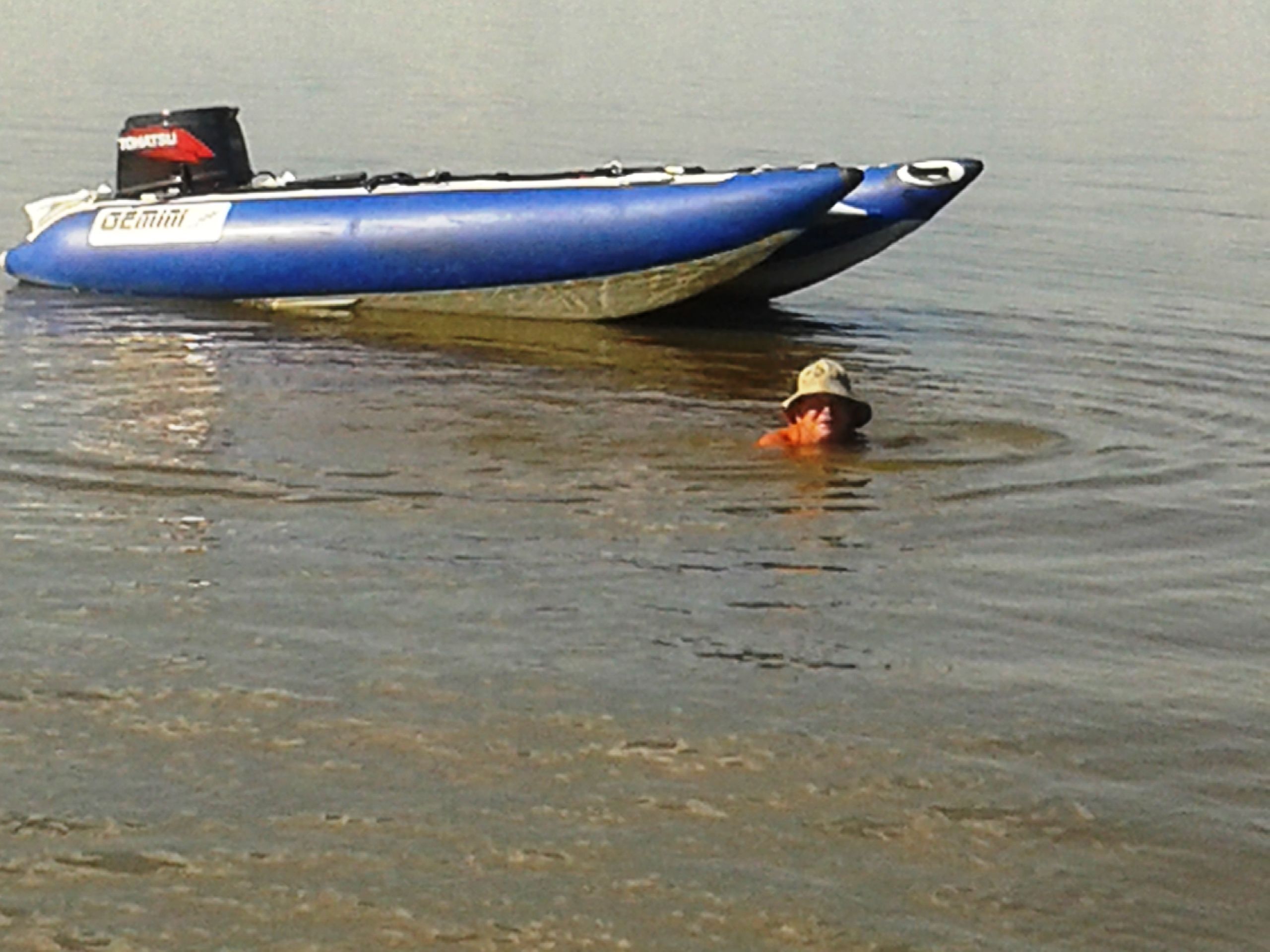 A blue boat with a label on its side.