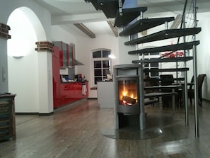 Enjoy cooking in the kitchen with a stove and dining area for meals and socializing.