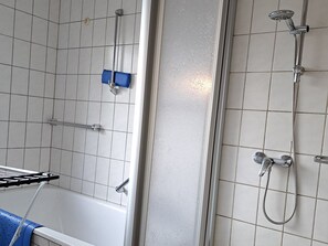 Bathtub, hair dryer, towels