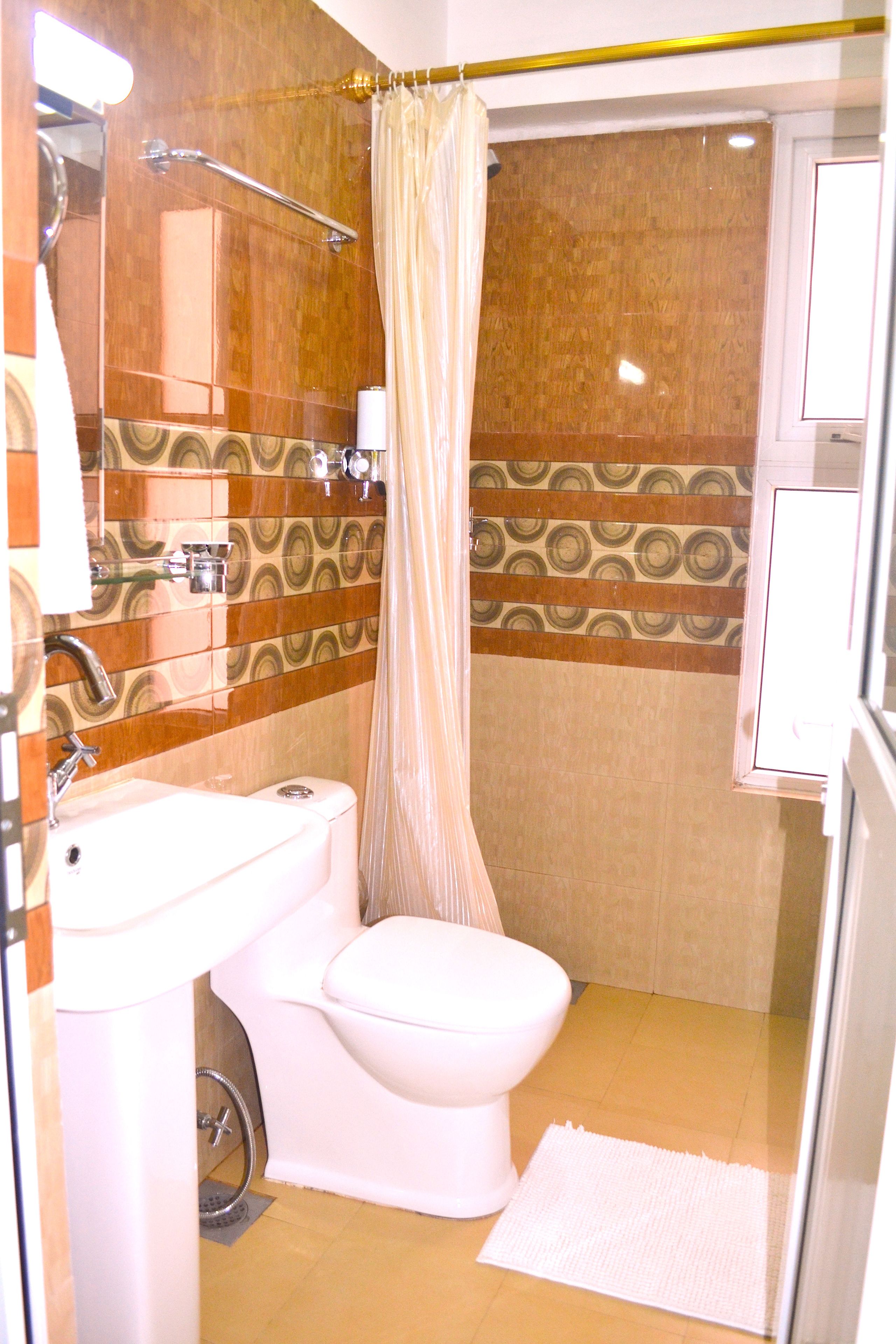 family room | bathroom | rainfall showerhead, free toiletries, hair dryer, slippers