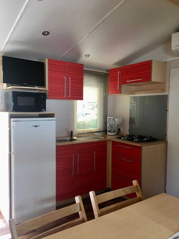 Fridge, microwave, stovetop, coffee/tea maker