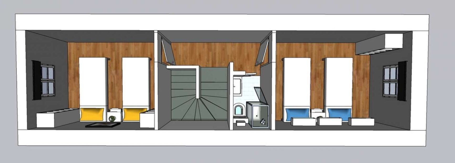 Une chambre d’hôtel avec un mur en bois, un lit, un bureau, une chaise, une armoire et une salle de bain équipée de toilettes et d’un lavabo.