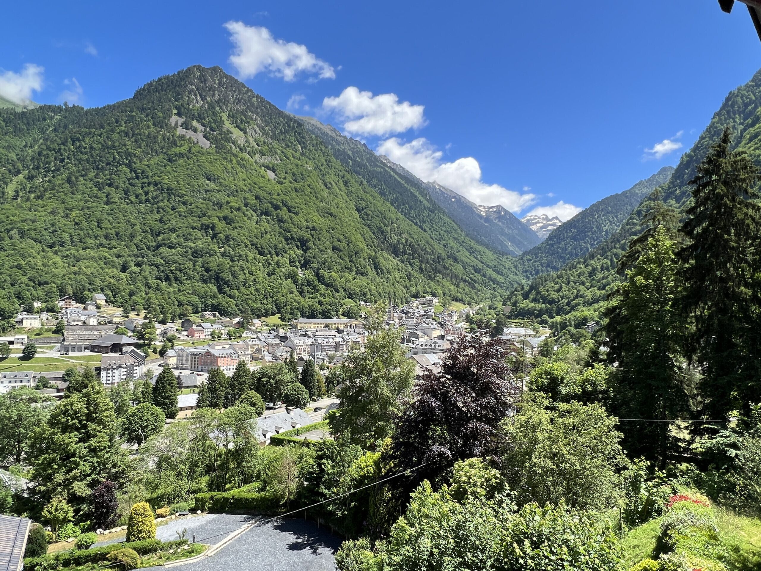 A mountainous landscape with a town nestled in a valley.