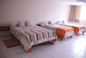 Desk, blackout drapes, iron/ironing board, rollaway beds