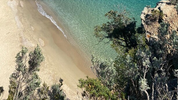 A coastal landscape with a clear beach, rocky outcrops, and a backdrop of hills with buildings. - St Tropez Gulf, luxury villa, very close to the sea with Jaccuzi Ste Maxime (Sainte-Maxime)